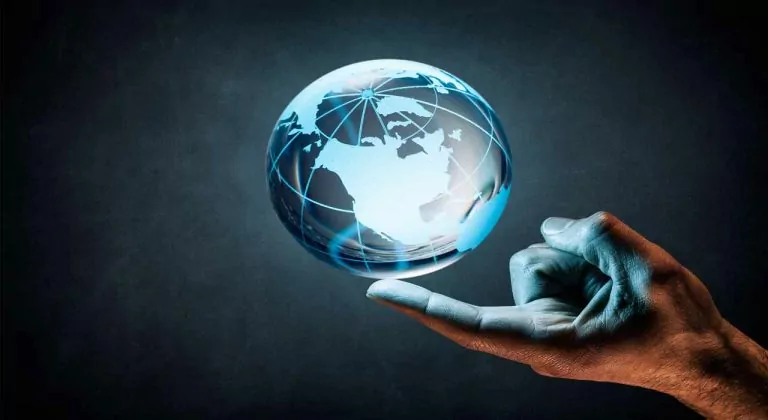 a hand holding the globe