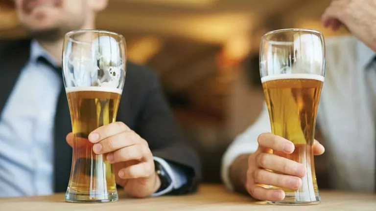 Two men drinking beer